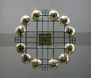 The design of the chandeliers in Durham Center inspired the logo.