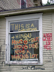 Grafitti on window by main door.